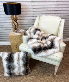 White and brown striped fake fur blanket with matching cushion