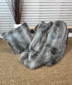 Grey striped fur blanket with fur cushion