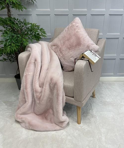 Plain pastel pink fake fur blanket with matching cushion