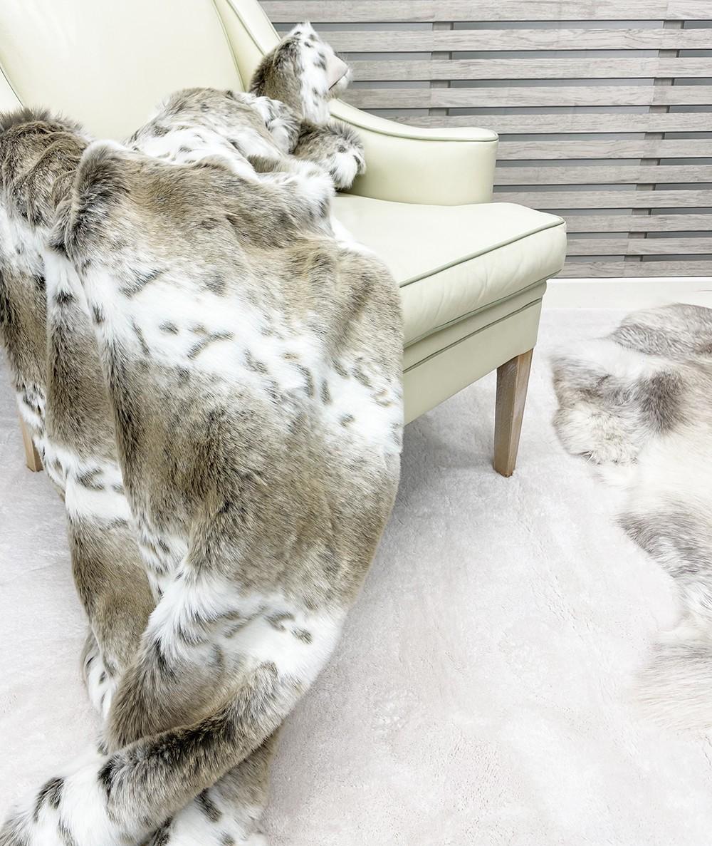 Soft, pale taupe and white striped fur blanket