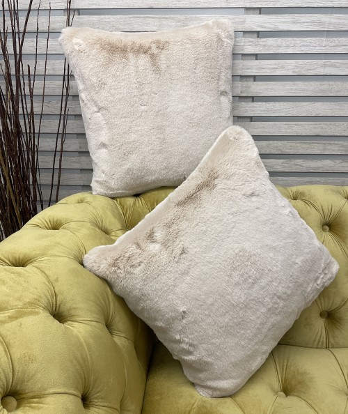 Light coloured fur cushions