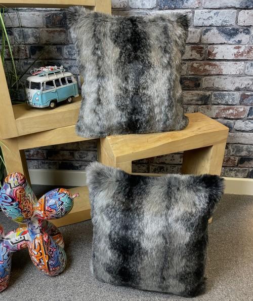 Grey and black striped faux fur cushions