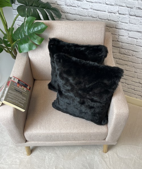 Plain black fake fur cushions