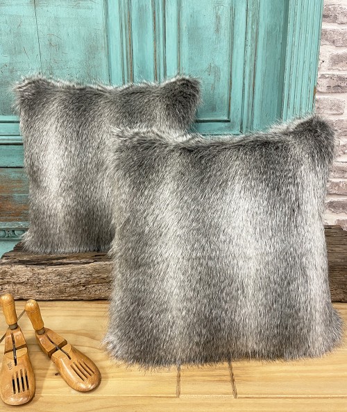 Grey patterned fur cushions