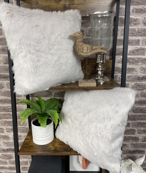 Modern silvery white fur cushions