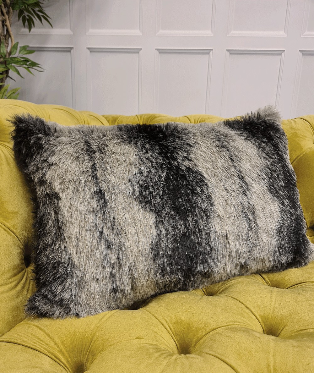 Black and grey striped rectangular faux fur cushions