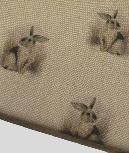 Close up image of the small rabbit print seat pad fabric