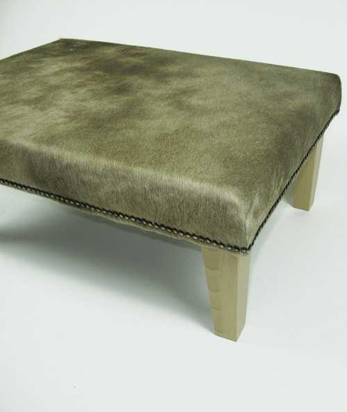 Rectangular cowhide footstool in beige/gold